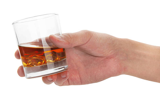 istock Glass of whisky in hand 500020259