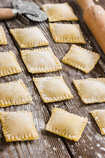 istock Raw ravioli on wooden background 500020614