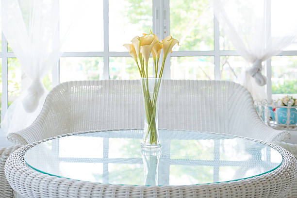 istock Yellow flower in vase on table and window sill background 500023281
