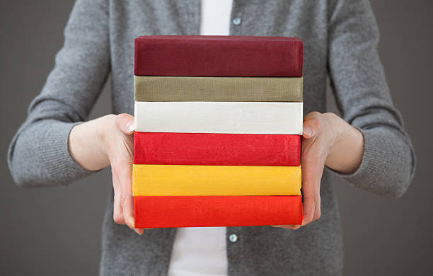 istock Unrecognizable young woman holding books 500031526