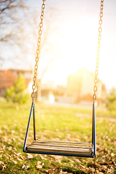 пустой swing - swing playground empty abandoned стоковые фото и изображения