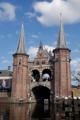 Sneek, Holland - april 6,2013: The famous watergate in sneek and people in the background.