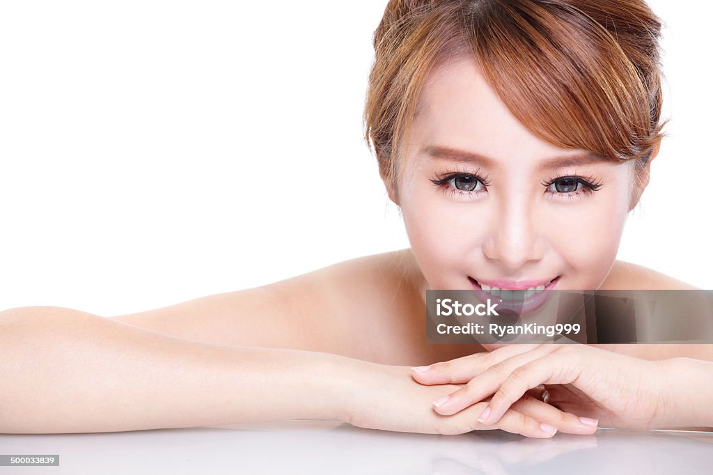 beauty woman face with mirror reflection Beautiful face skincare beauty woman lying down with mirror reflection . asian beauty model Adult Stock Photo