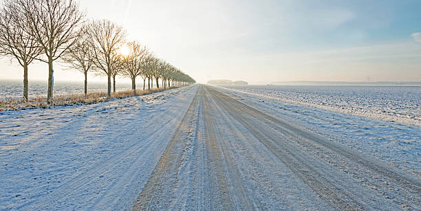 istock Snowy road at sunset in winter 500034200