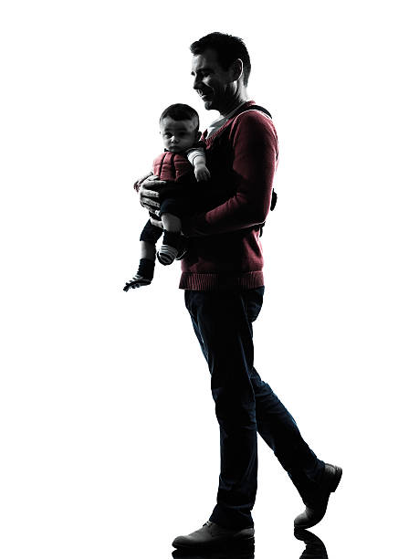 istock man father walking with baby silhouette 500034311