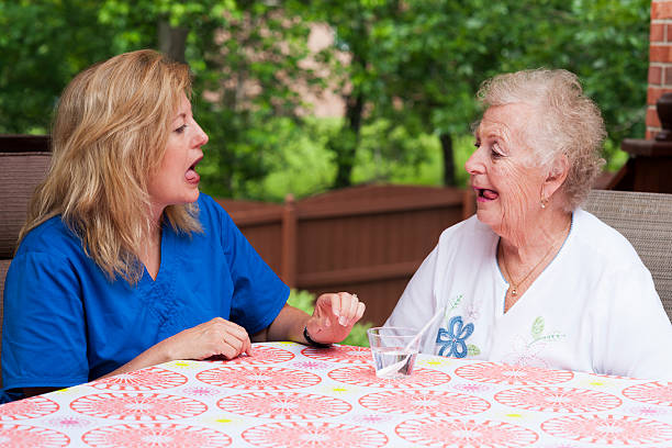 istock Therapist models oral motor exercises in speech therapy 500034469