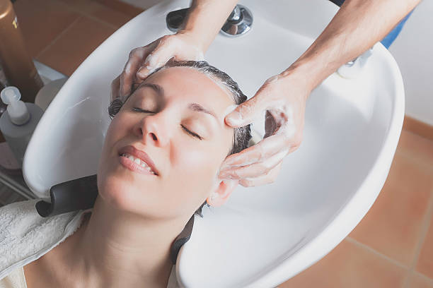 istock hair massage at shampoo chairs 500035047