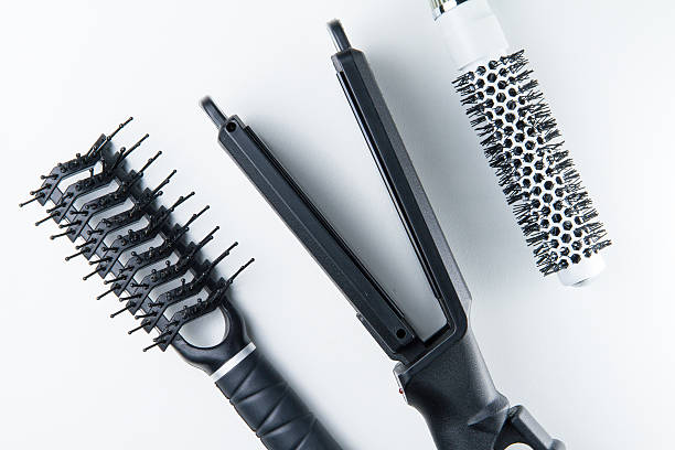 istock Electric hair straightener brush roll and comb. 500037178