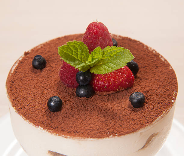 istock Tiramisu cake in glass with small fruits 500039127