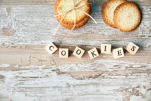 istock Top view of stack cookies and focused letters 500044068
