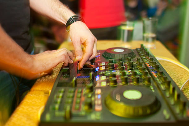 istock DJ mixing music on console at the night club 500047964