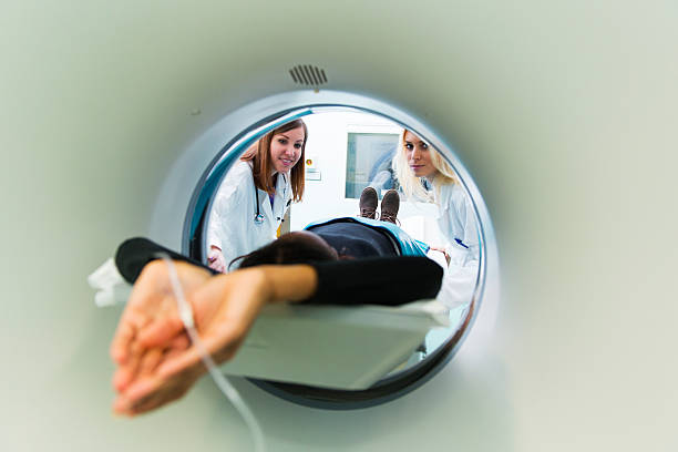 istock Young black woman waiting for CAT scan with contrast 500048266