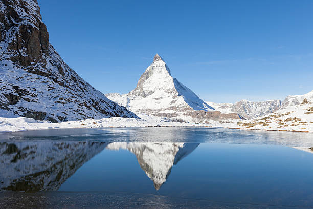 istock Matterhorn with reflection in Riffelsee, Zermatt, Switzerland 500048992