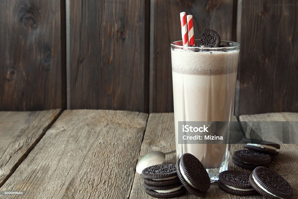 milkshake (chocolate smoothie) with cookies Homemade milkshake (chocolate smoothie) with cookies on rustic wooden table with copy space Cookie Stock Photo