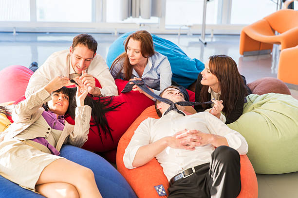 istock Business people relaxing...chatting and smiling in a brainstorming room 500050054