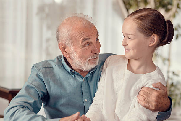 istock Young girl and grandfather 500055786