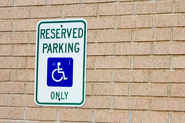 istock Reserved handicapped parking sign on brick wall 500058656