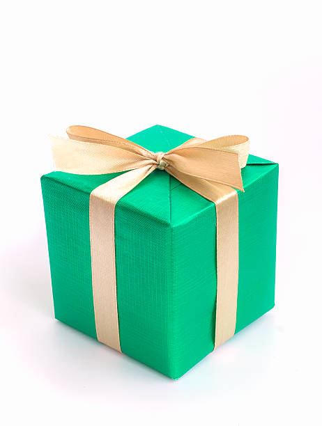 istock Green gift box with gold ribbon isolated on white background 500062908