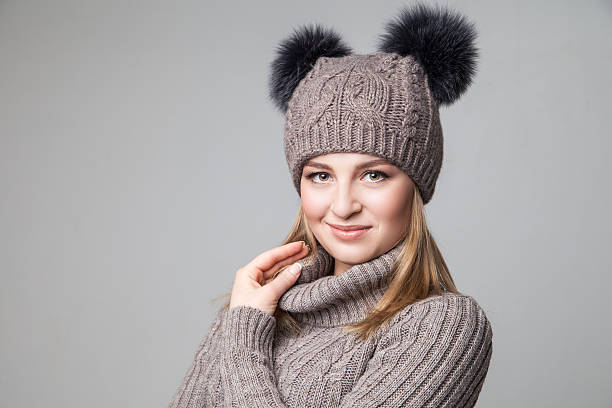 istock Beautiful blond girl wears winter pullover and hat 500063192