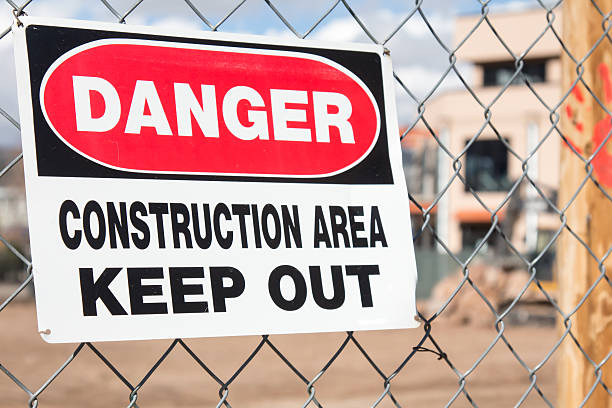 istock Danger Construction Area sign on chain link fence 500063416