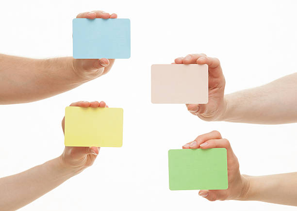 istock Human hands holding colorful paper cards 500063614