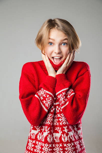 istock Girl wrapped in a warm knitted sweater. 500063744