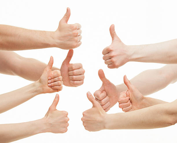 istock Many hands showing  thumb up signs 500073512