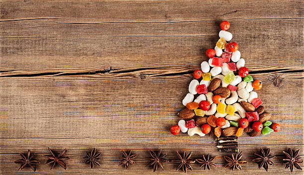 istock Christmas card with natural decorations on wooden background 500074100