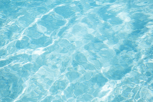 Sunlight and surface of a swimming pool