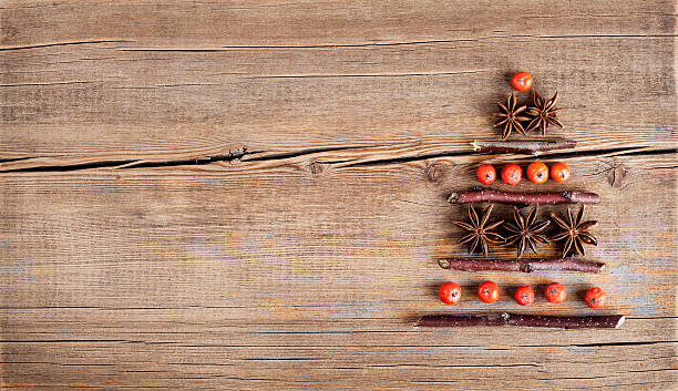 istock Christmas card with natural decorations on wooden background 500074420