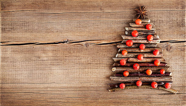 istock Christmas card with natural decorations on wooden background 500074524