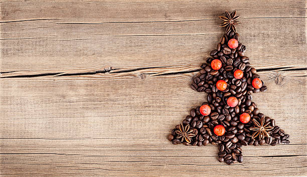 christmas tree made of coffee beans on wooden table - julfika bildbanksfoton och bilder