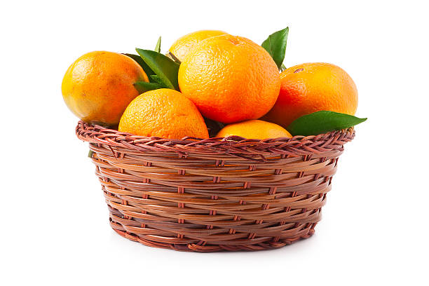 istock organic ripe mandarins in basket on white background 500079952