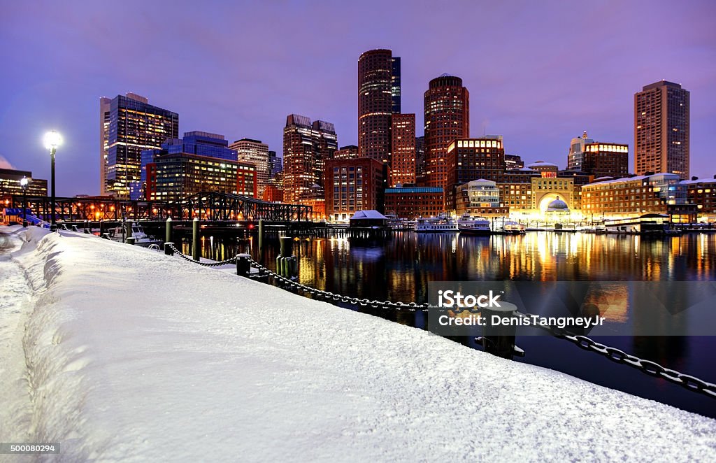 Boston skyline during the historic 2015 winter Snowiest Winter in Boston's History. More than 9 feet of snow shutdown all subway and rail services leading to the activation of the National Guard to help clear the snow. Photo taken along a city street in the East Boston neighborhood. Boston is the capital and largest city in  Boston - Massachusetts Stock Photo