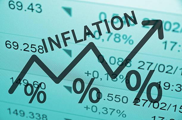 Inflation Word Inflation on up trend arrow, with financial data visible on the background. inflation economics photos stock pictures, royalty-free photos & images
