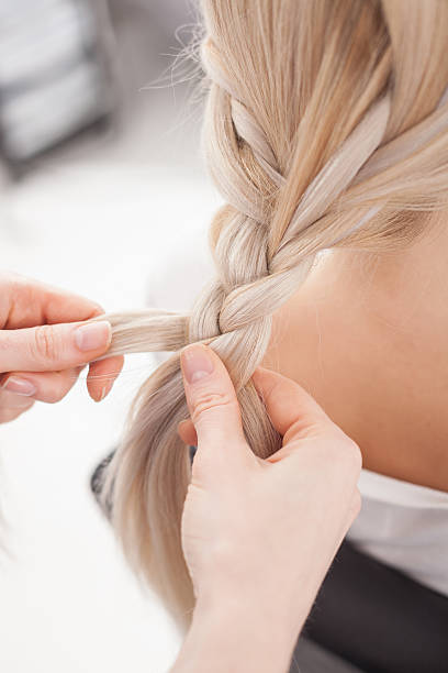 istock Skillful female hairstylist is making pretty braid 500091062