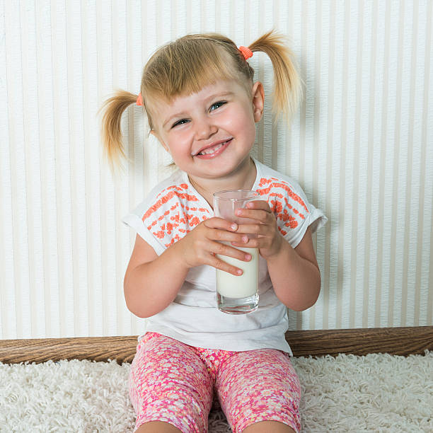 istock happy girl  drink the milk 500091776