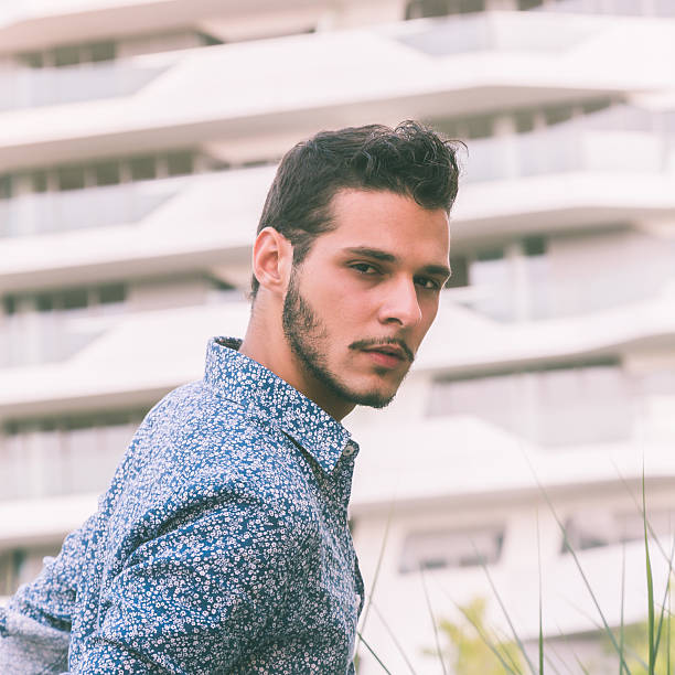 istock Young handsome man posing in the city streets 500092026