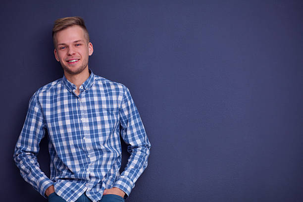 istock Portrait of a handsome young man on black background 500094362