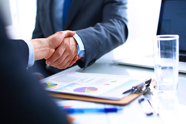 istock Business people shaking hands, finishing up a meeting 500095232