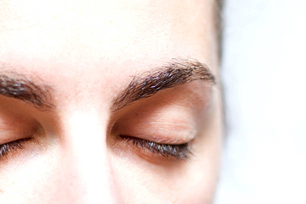 istock Female green eye closed 500096656