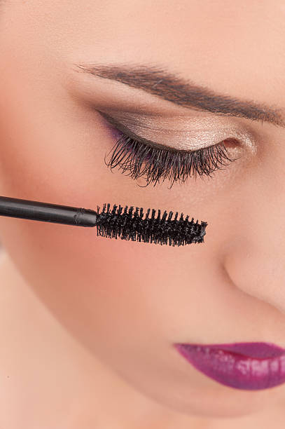 istock Cheerful young woman is getting make-up treatment 500109000