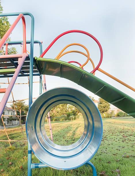istock children's playground, a slider located on the lawn 500111240