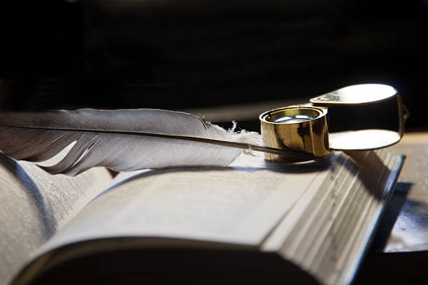 istock open book and quill pen 500119447