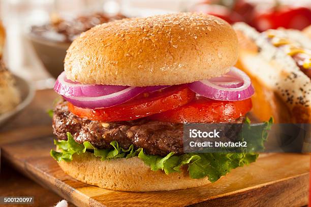 Hearty Grilled Hamburger With Lettuce And Tomato Stock Photo - Download Image Now - Hamburger, Barbecue - Meal, Barbecue Grill