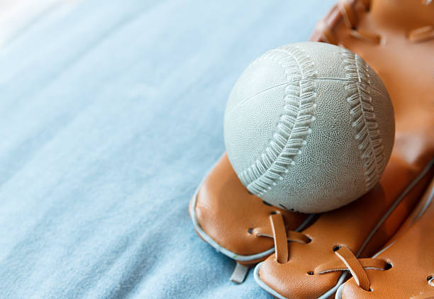 Closeup of baseball in glove