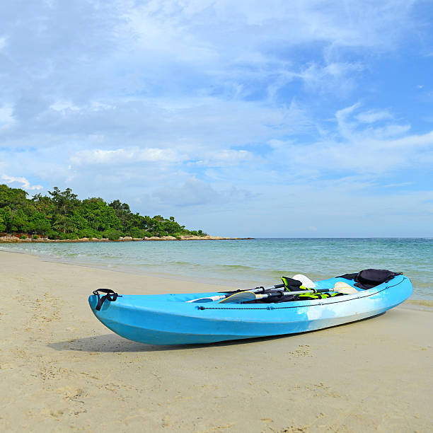 istock Blue kayaks on the tropical beach 500121875