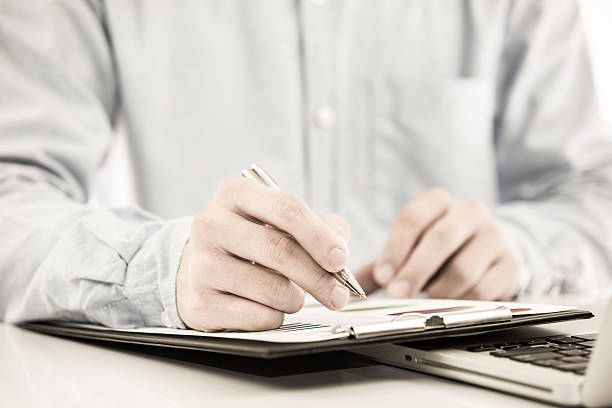 istock Businessman analyzing investment charts with laptop 500123193