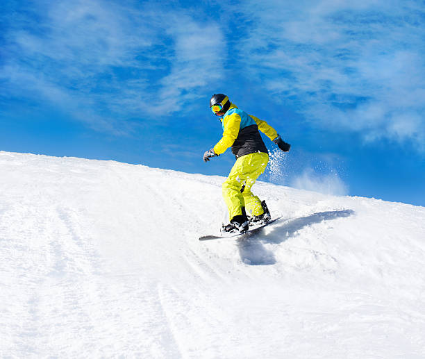 istock Snowboarder sliding down the hill, snow mountains snowboarding on slopes 500124137