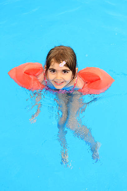 istock Girl swimming in the pool 500124721